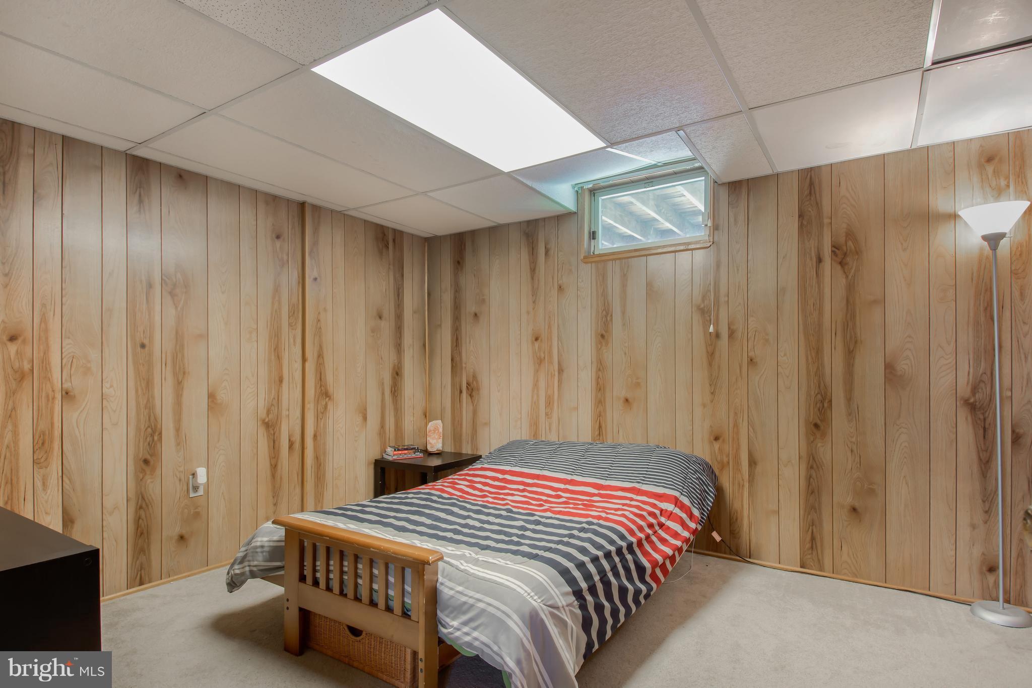 1831 Potomac Road Edgewater, MD 21037 - Photo 15 of 27 a bedroom with a bed and a window