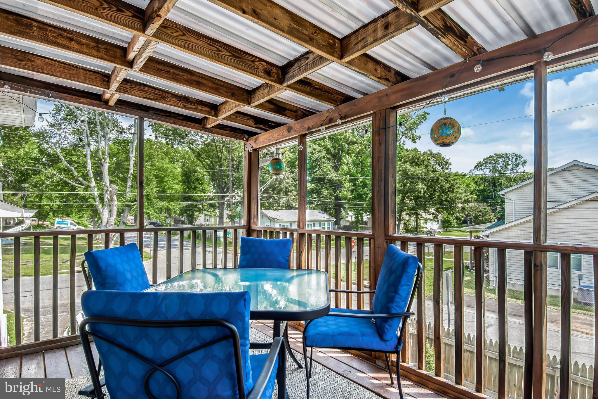 1831 Potomac Road Edgewater, MD 21037 - Photo 7 of 27 a view of a porch with furniture and a yard
