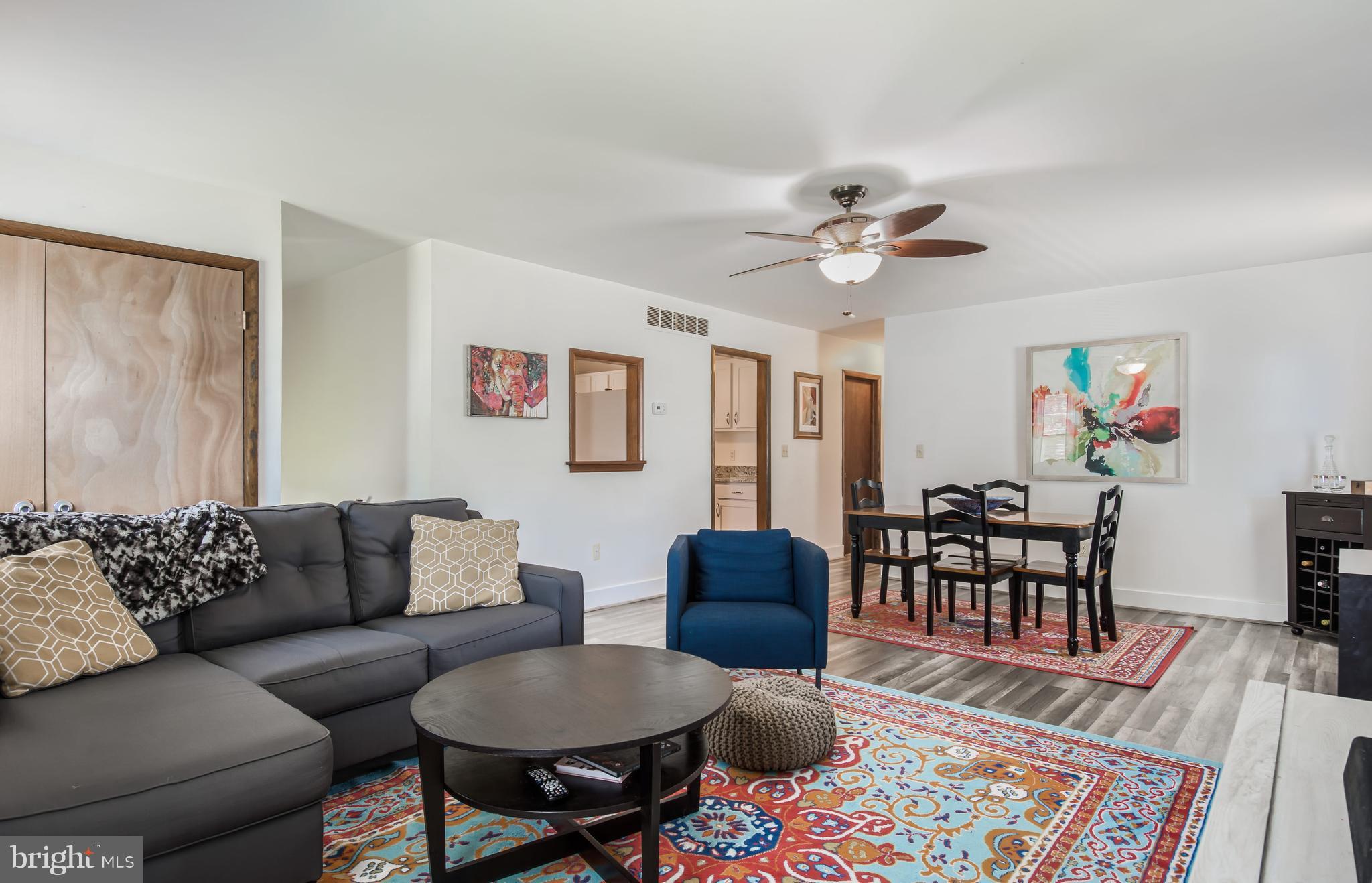 1831 Potomac Road Edgewater, MD 21037 - Photo 27 of 27 a living room with furniture and a wooden floor