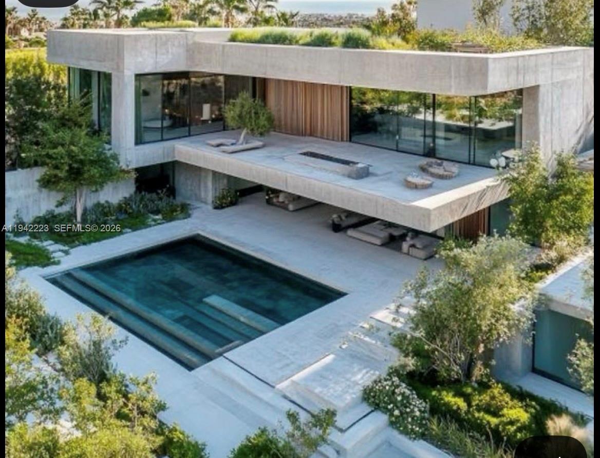 811 86th Street Miami Beach, FL 33141 - Photo 2 of 13 an aerial view of a house with a swimming pool