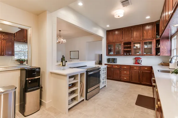 a bathroom with a granite countertop sink double vanity and a mirror