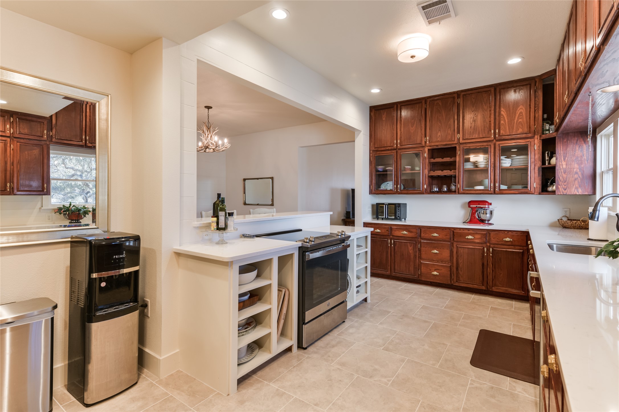 0 County Road 476 Road Rochelle, TX 76872 - Photo 15 of 40 a kitchen with stainless steel appliances a stove a sink dishwasher a refrigerator and a oven with wooden cabinets