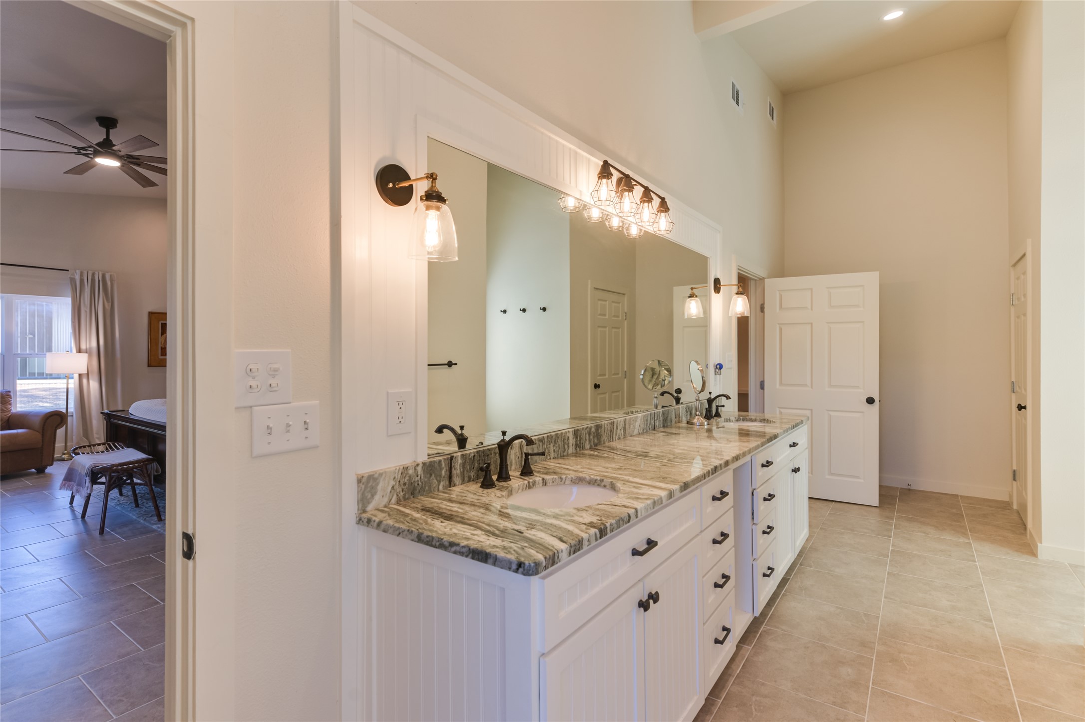 0 County Road 476 Road Rochelle, TX 76872 - Photo 18 of 40 a bathroom with a granite countertop sink double vanity and a mirror