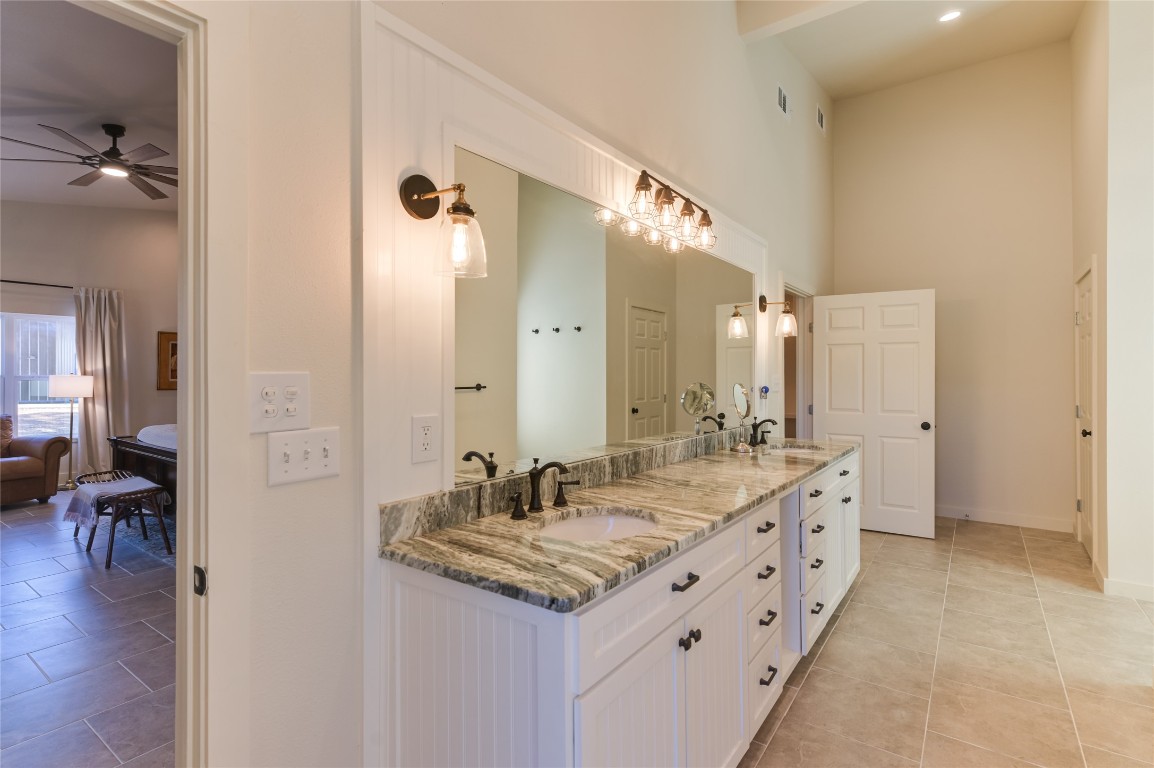 0 County Road 476 Road Rochelle, TX 76872 - Photo 18 of 40 a bathroom with a granite countertop sink and a mirror