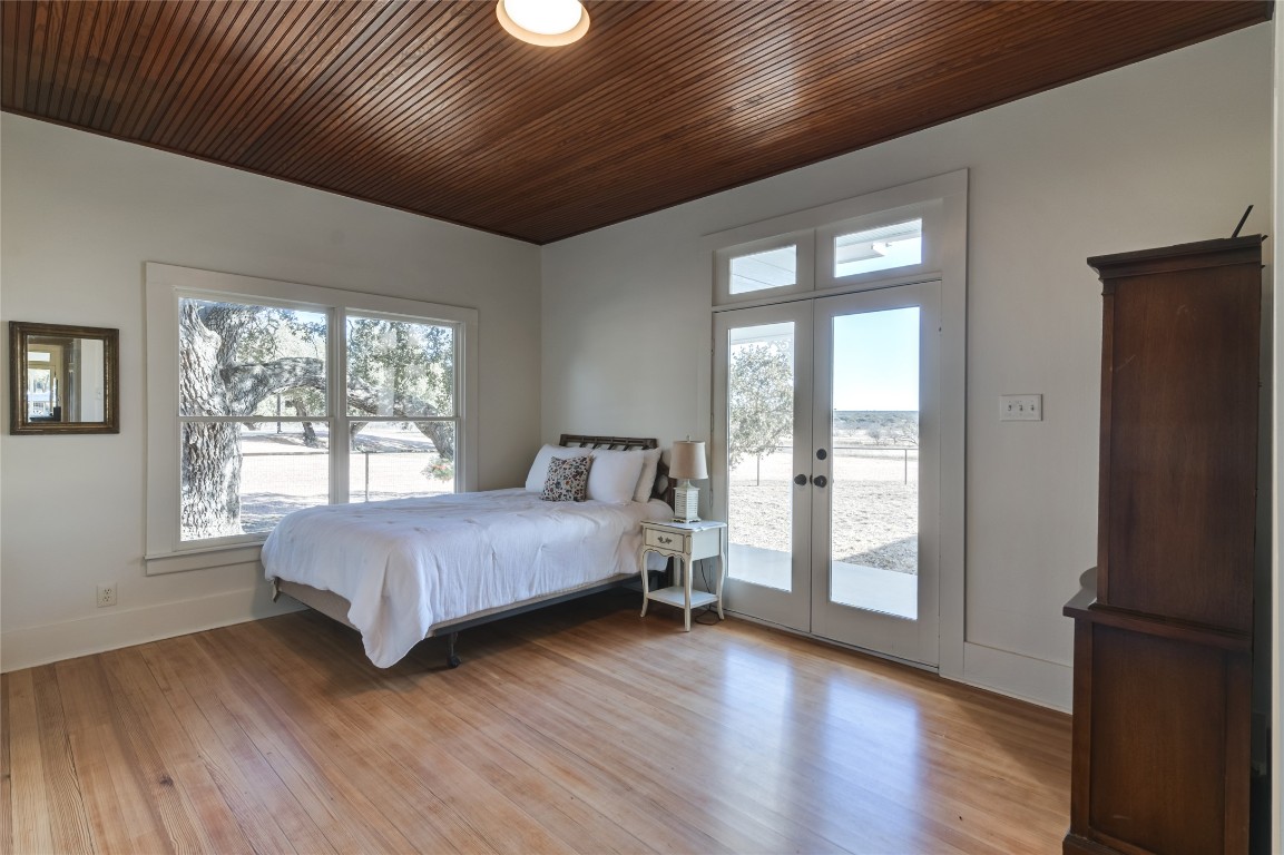 0 County Road 476 Road Rochelle, TX 76872 - Photo 30 of 40 a bedroom with a bed and wooden floor