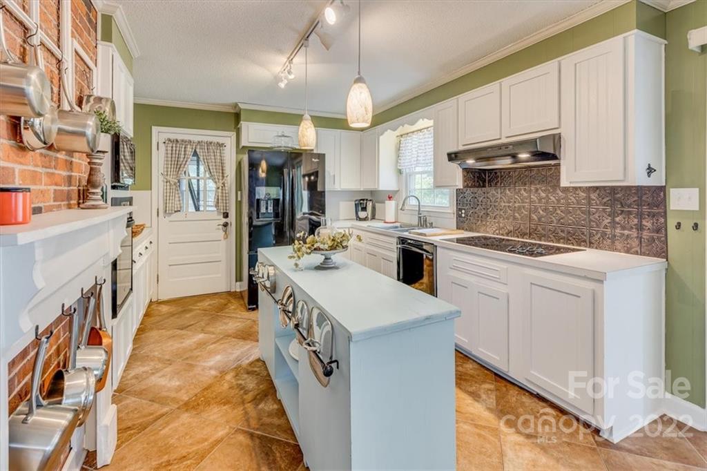 740 North Beersheba Road Clover, SC 29710 - Photo 11 of 46 a kitchen that has a lot of white cabinets and stainless steel appliances