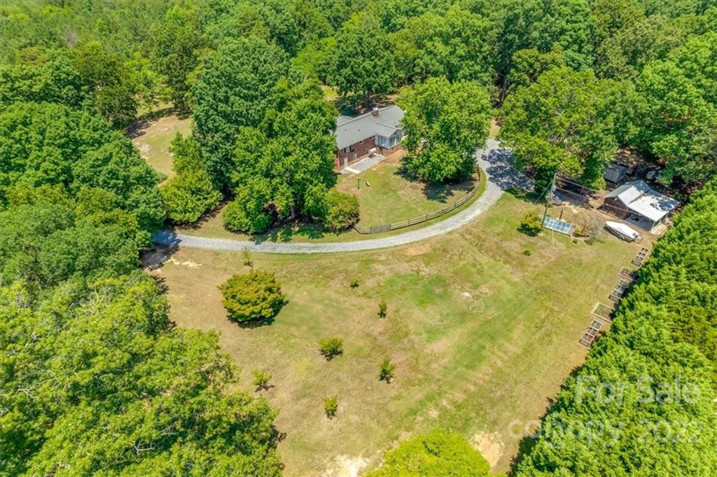 740 North Beersheba Road Clover, SC 29710 - Photo 41 of 46 a view of a garden with a fountain