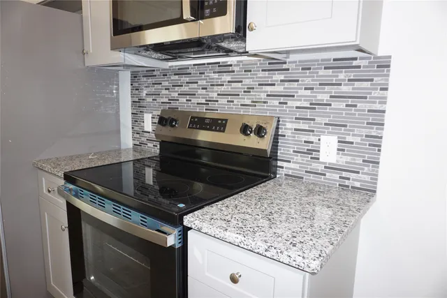 a view of a bathroom with a sink and a window