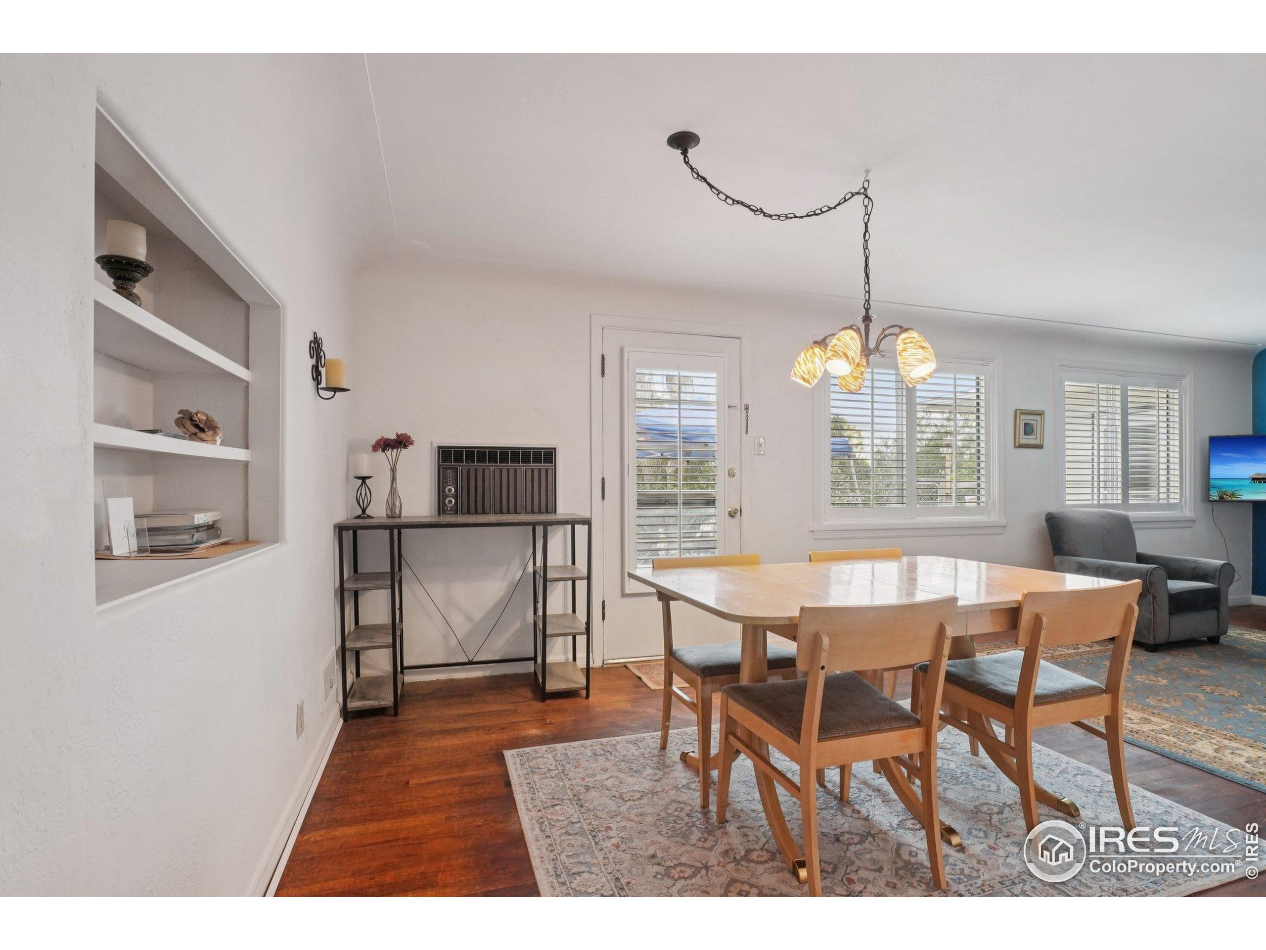 1110 South Quitman Street Denver, CO 80219 - Photo 15 of 43 a dining room with furniture and window