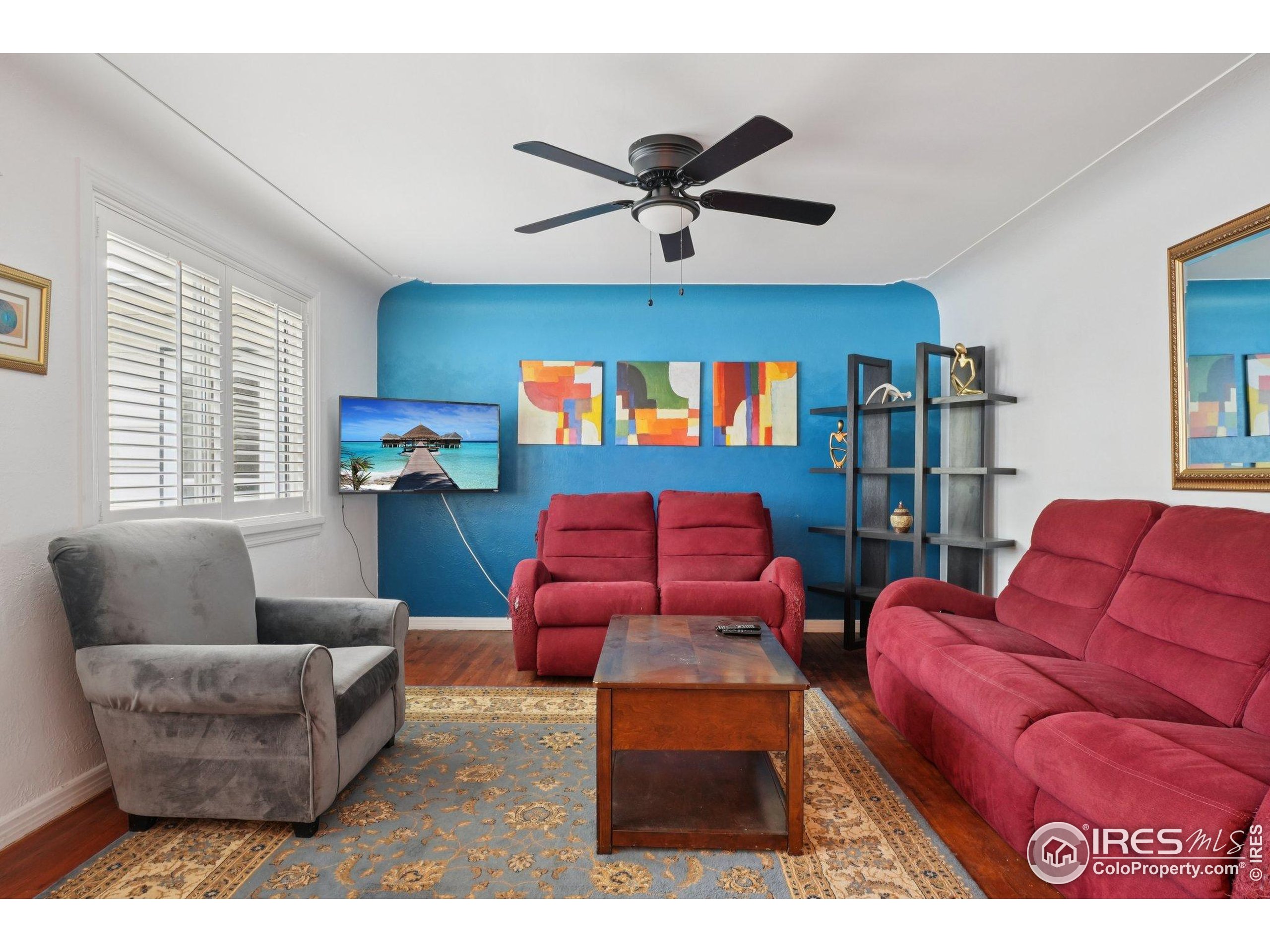 1110 South Quitman Street Denver, CO 80219 - Photo 16 of 43 a living room with furniture and a window
