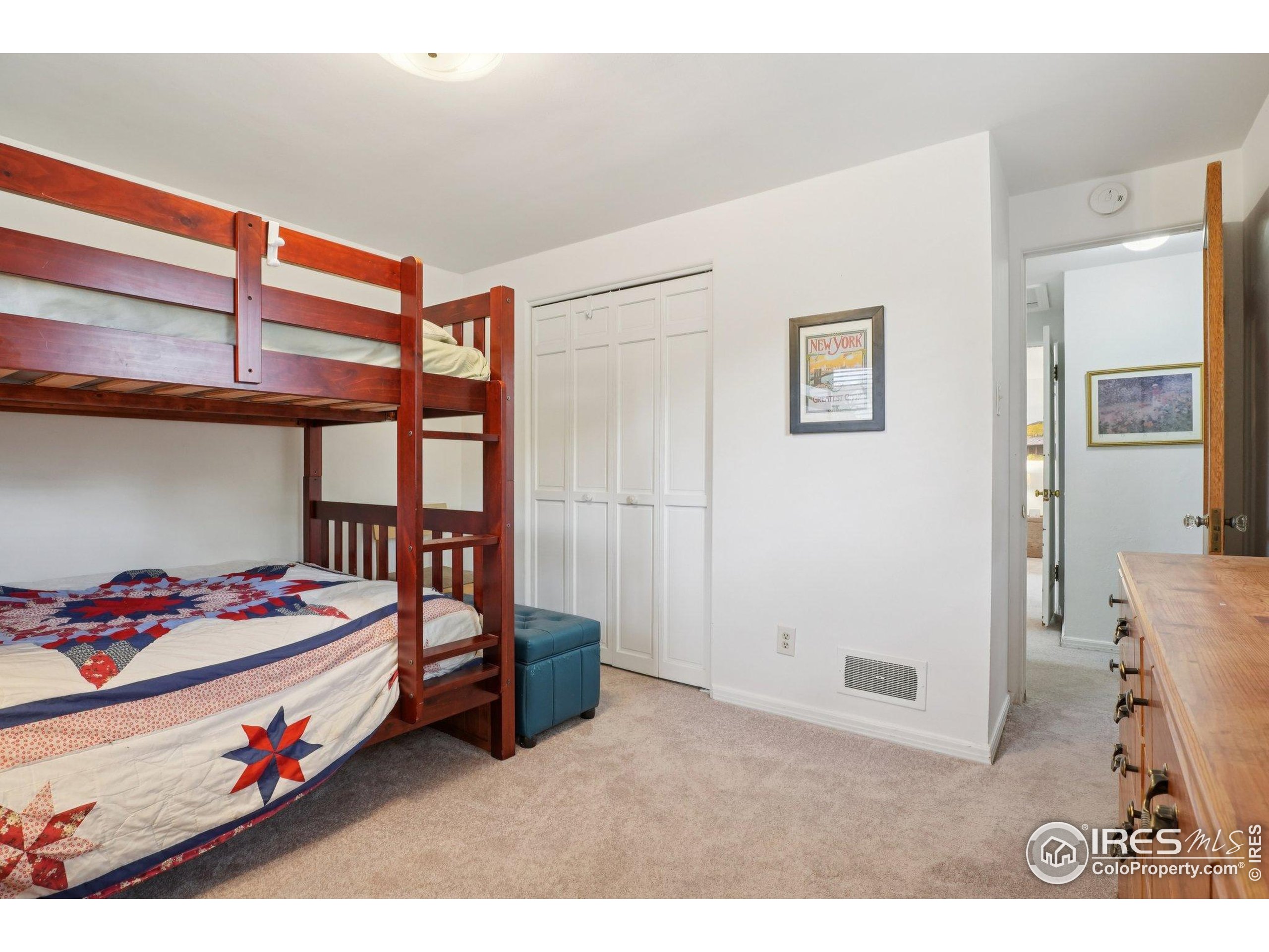 1110 South Quitman Street Denver, CO 80219 - Photo 24 of 43 a bedroom with a bed and a window