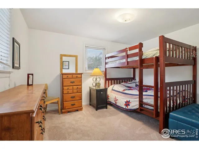 a view of a backyard with large trees