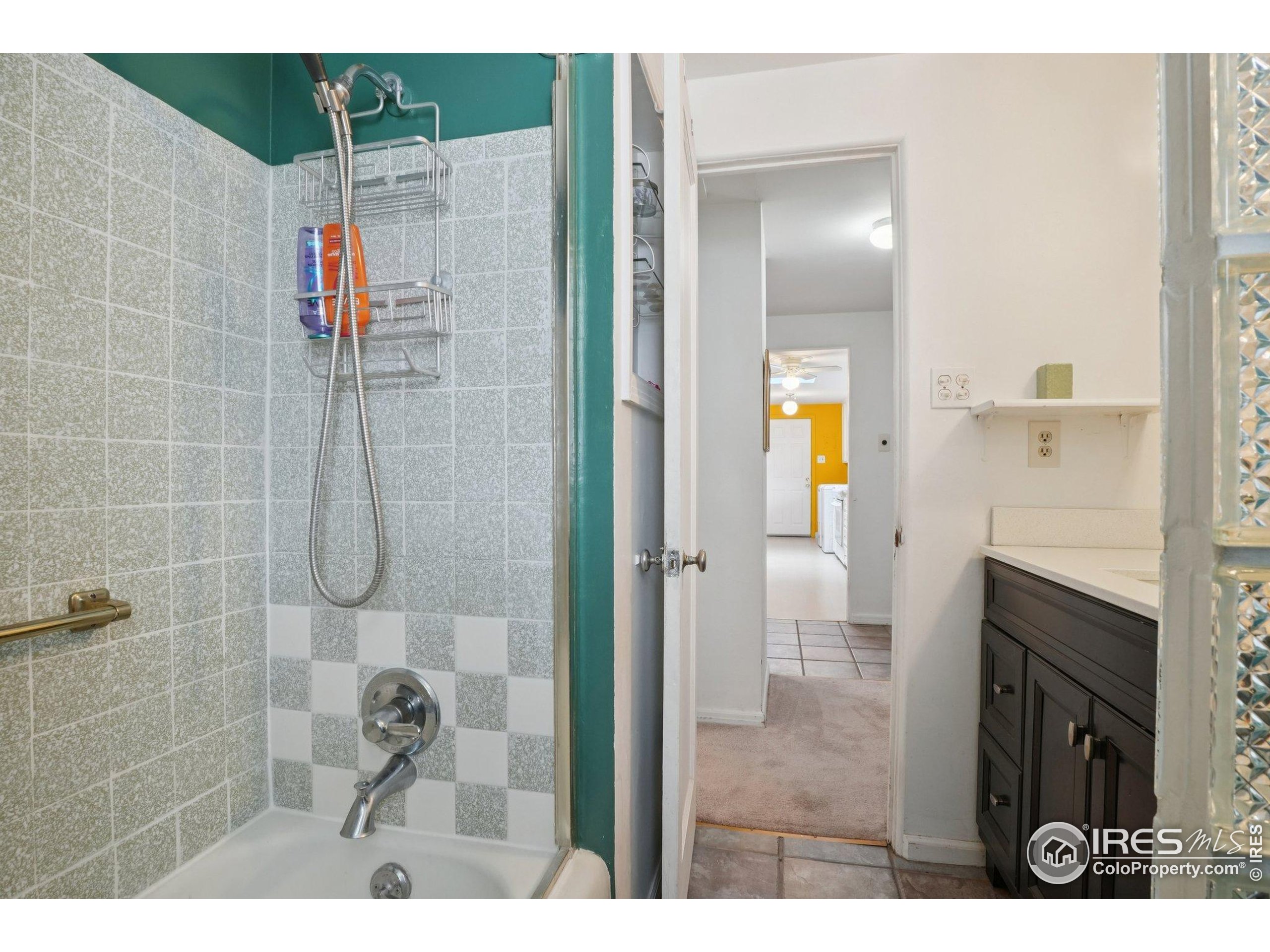 1110 South Quitman Street Denver, CO 80219 - Photo 27 of 43 a bathroom with a shower and a sink