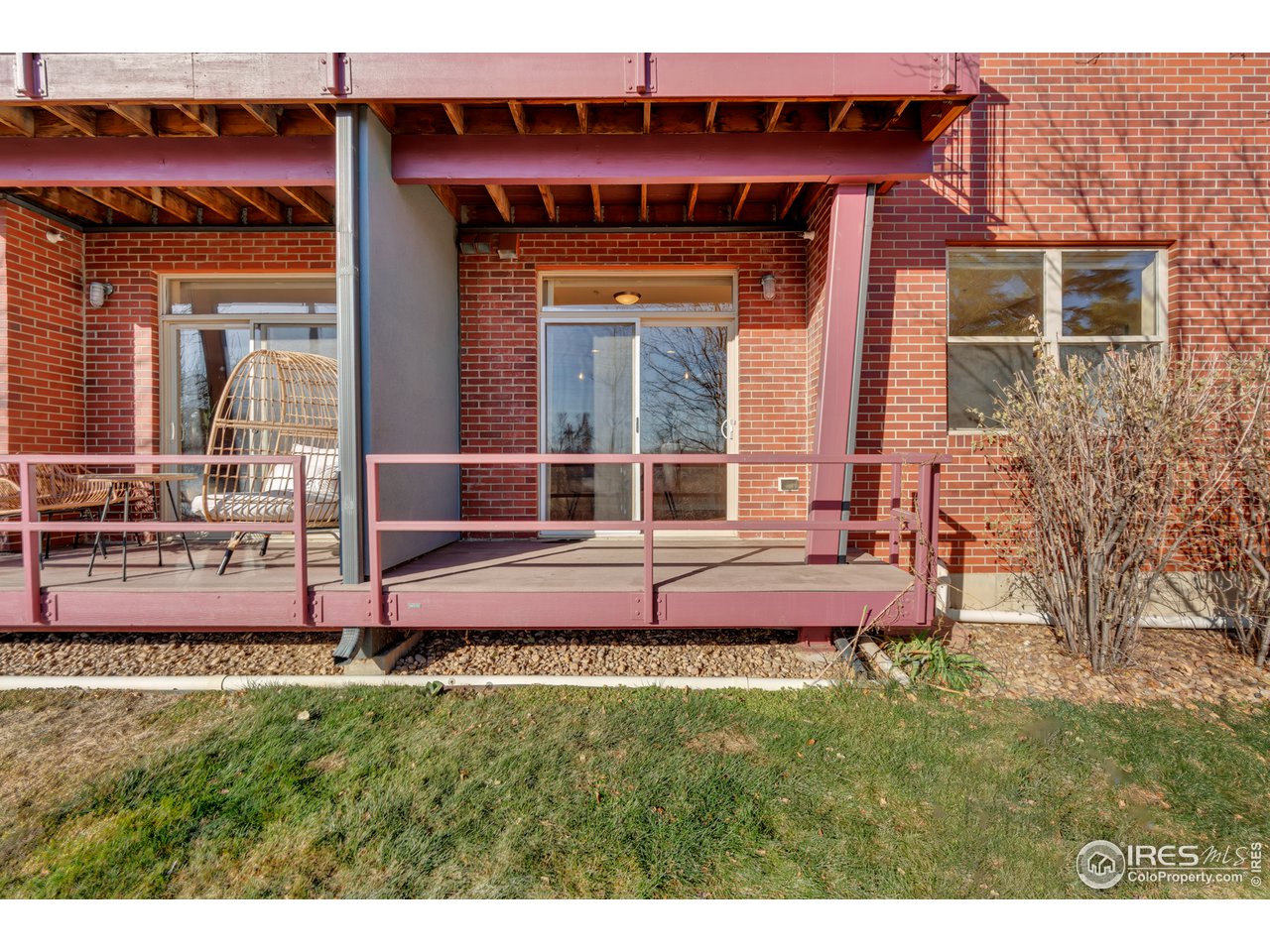 2920 Bluff Street, Unit 212 Boulder, CO 80301 - Photo 12 of 21 a front view of a house with a yard