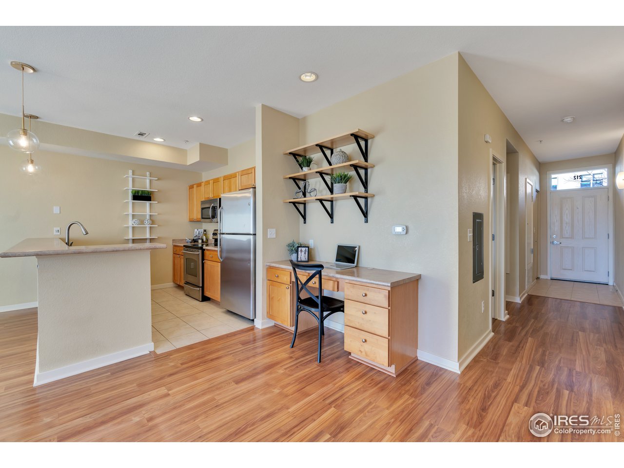 2920 Bluff Street, Unit 212 Boulder, CO 80301 - Photo 4 of 21 a view of kitchen with cabinets and wooden floor