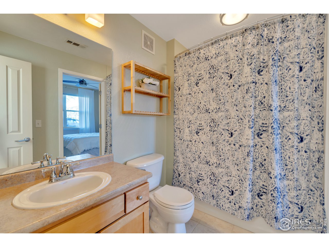 2920 Bluff Street, Unit 212 Boulder, CO 80301 - Photo 6 of 21 a bathroom with a sink toilet and mirror