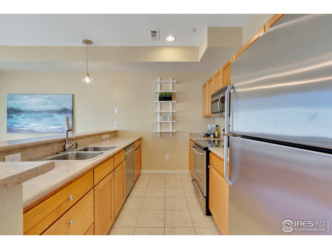 2920 Bluff Street, Unit 212 Boulder, CO 80301 - Photo 9 of 21 a kitchen with a sink stove and refrigerator