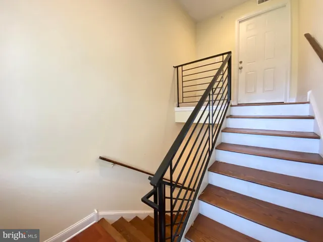 a view of a hallway with staircase