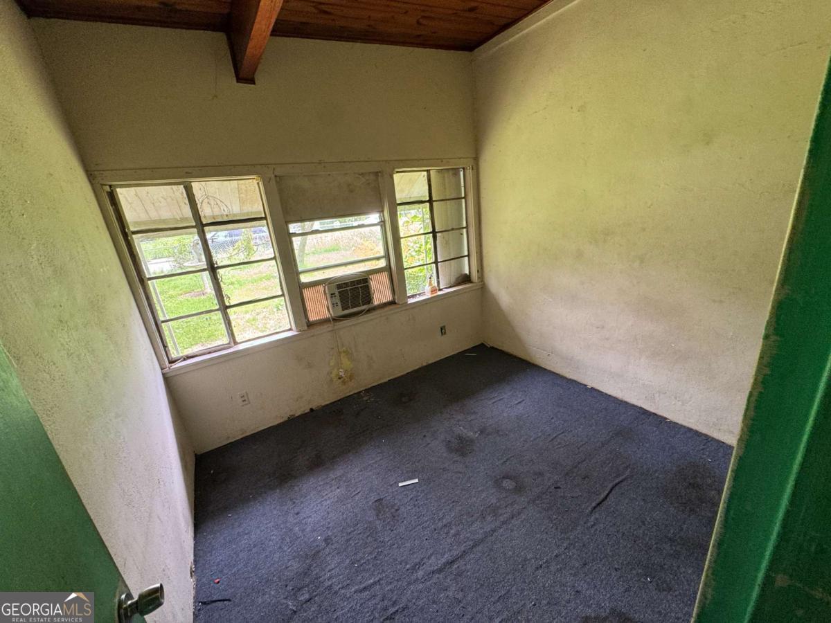 512 Dupont Street Augusta, GA 30901 - Photo 4 of 8 a view of an empty room with a window
