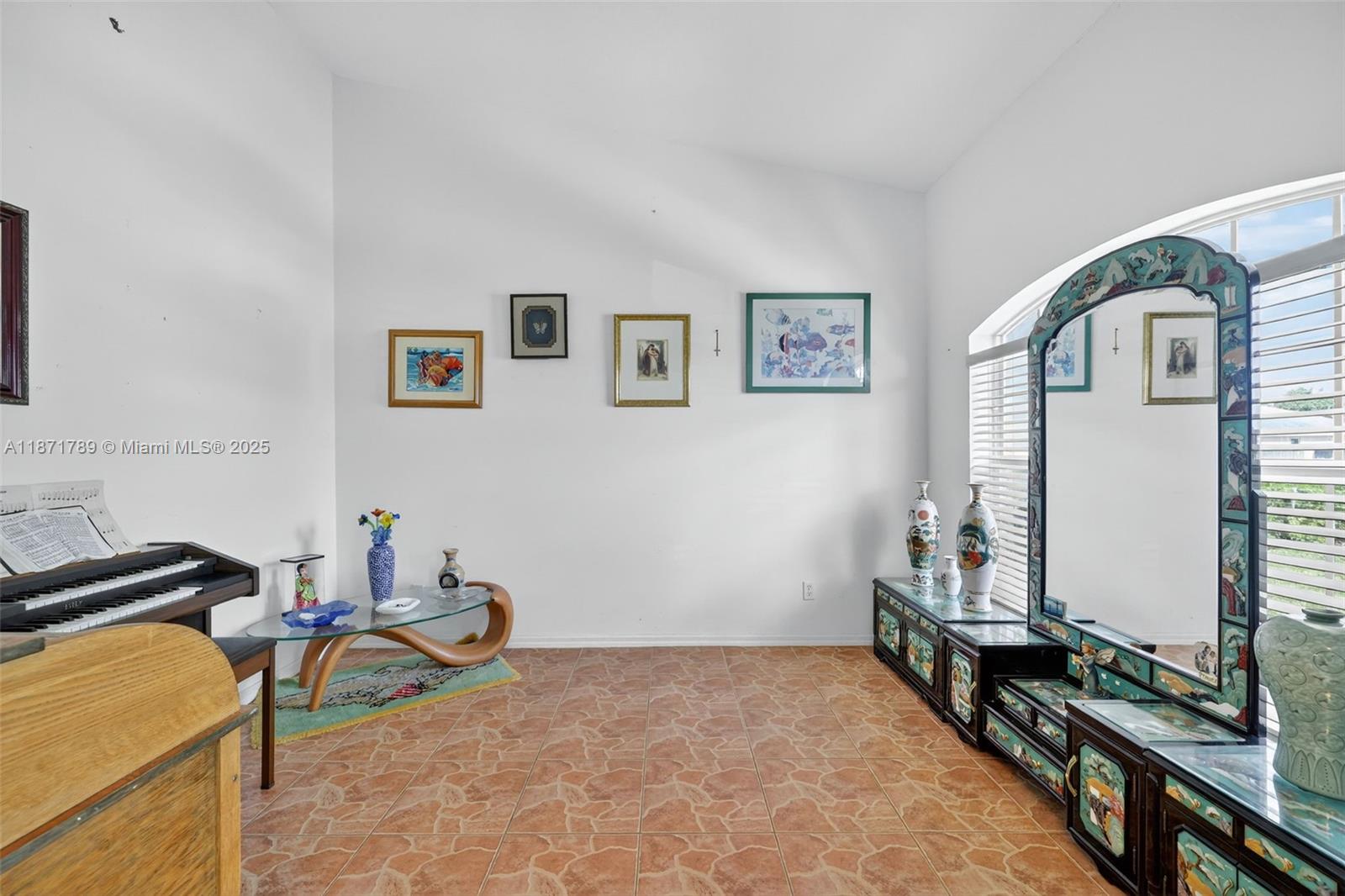 1019 Southwest California Boulevard Port St. Lucie, FL 34953 - Photo 19 of 40 a room with furniture and a flat screen tv