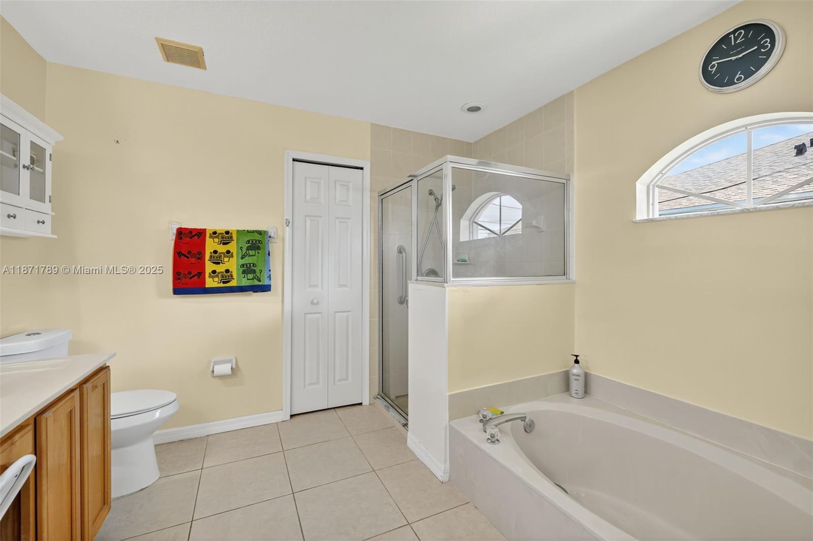 1019 Southwest California Boulevard Port St. Lucie, FL 34953 - Photo 29 of 40 a bathroom with a bathtub and shower