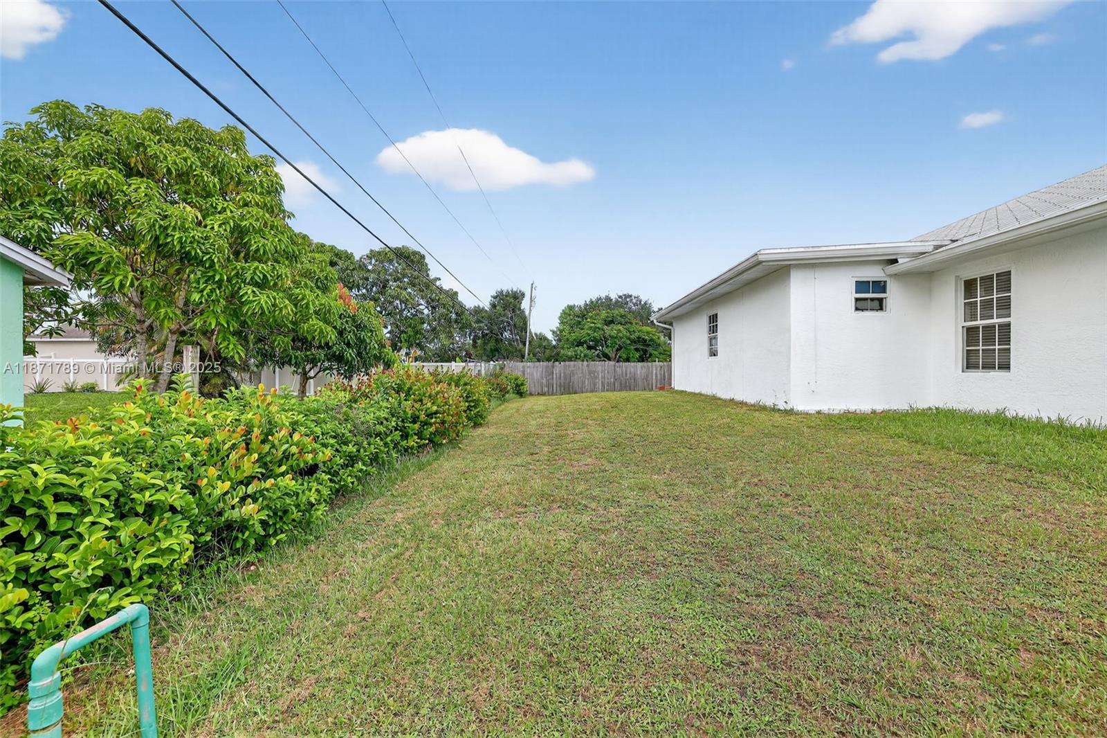 1019 Southwest California Boulevard Port St. Lucie, FL 34953 - Photo 36 of 40 a view of backyard of house