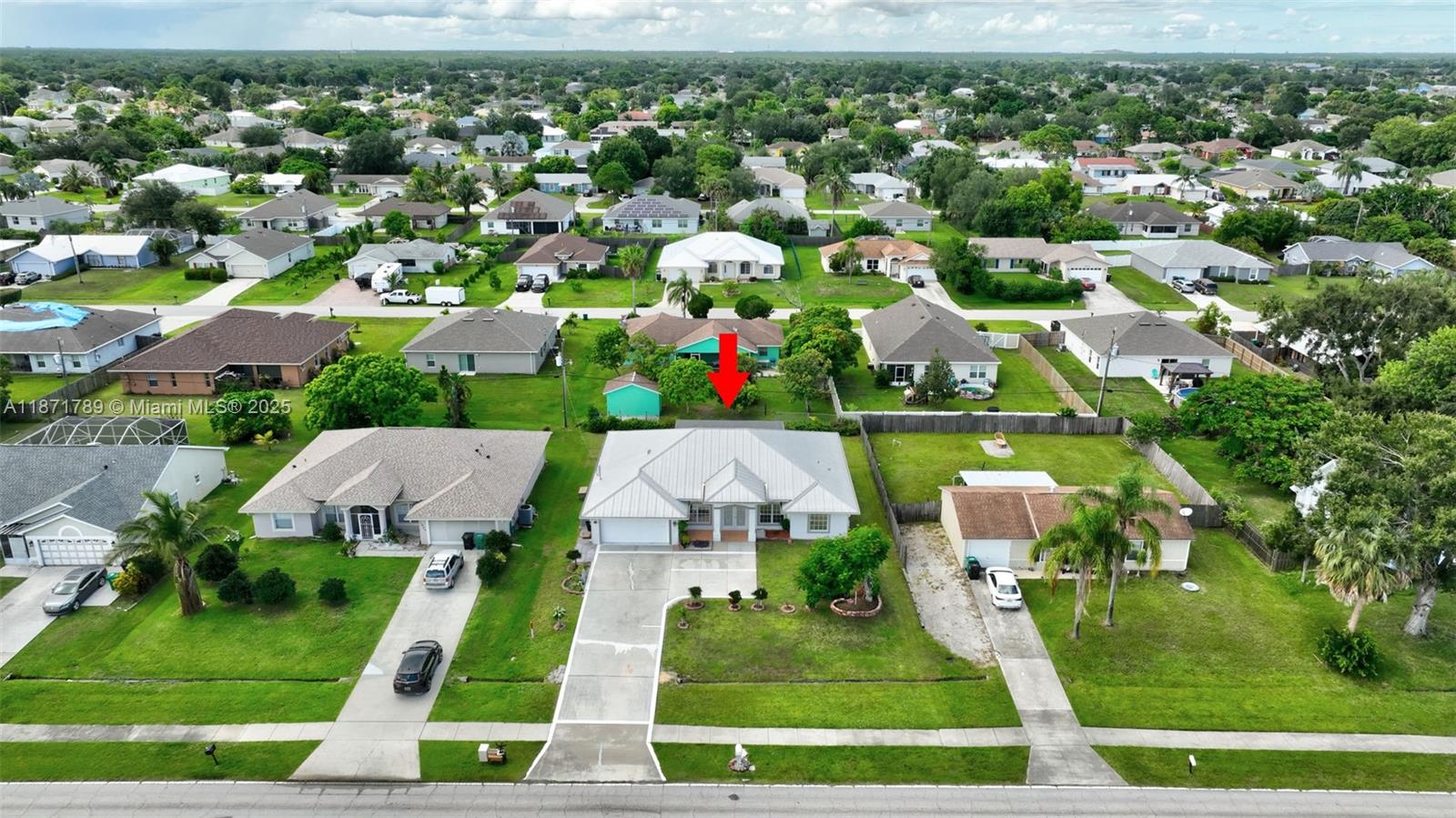 1019 Southwest California Boulevard Port St. Lucie, FL 34953 - Photo 38 of 40 an aerial view of house with yard