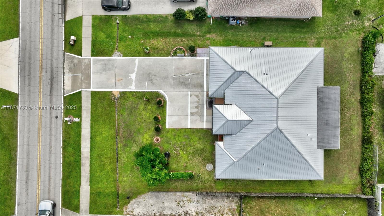 1019 Southwest California Boulevard Port St. Lucie, FL 34953 - Photo 40 of 40 an aerial view of a house with garden space and a patio