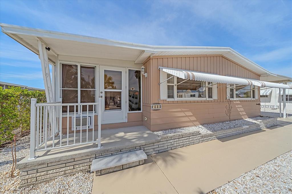 front view of a house with a view of a building