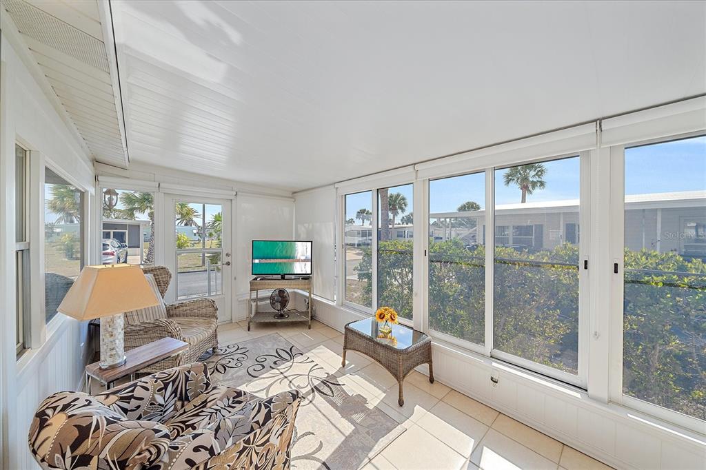 521 Roma Road Venice, FL 34285 - Photo 18 of 57 a living room with furniture and a large window