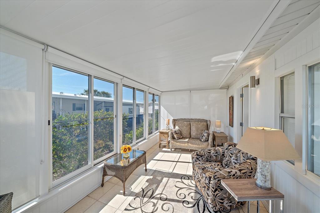 521 Roma Road Venice, FL 34285 - Photo 20 of 57 a living room with furniture and a large window