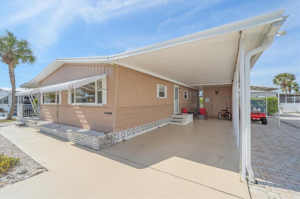 521 Roma Road Venice, FL 34285 - Photo 36 of 57 a front view of a house with a road