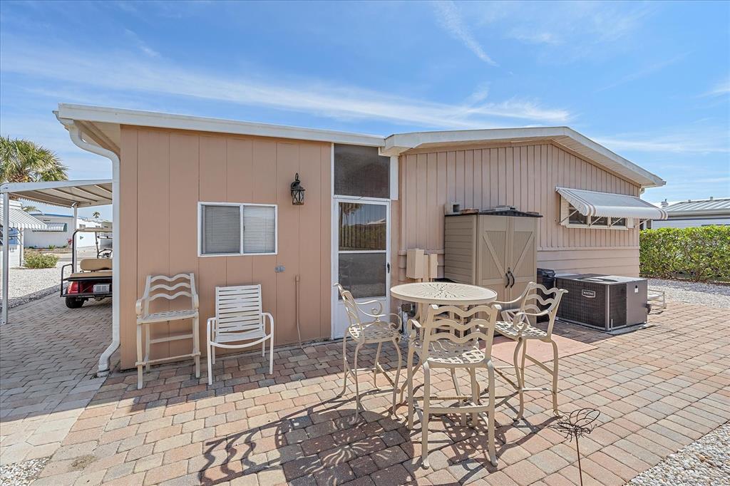 521 Roma Road Venice, FL 34285 - Photo 38 of 57 a view of a house with backyard and sitting area