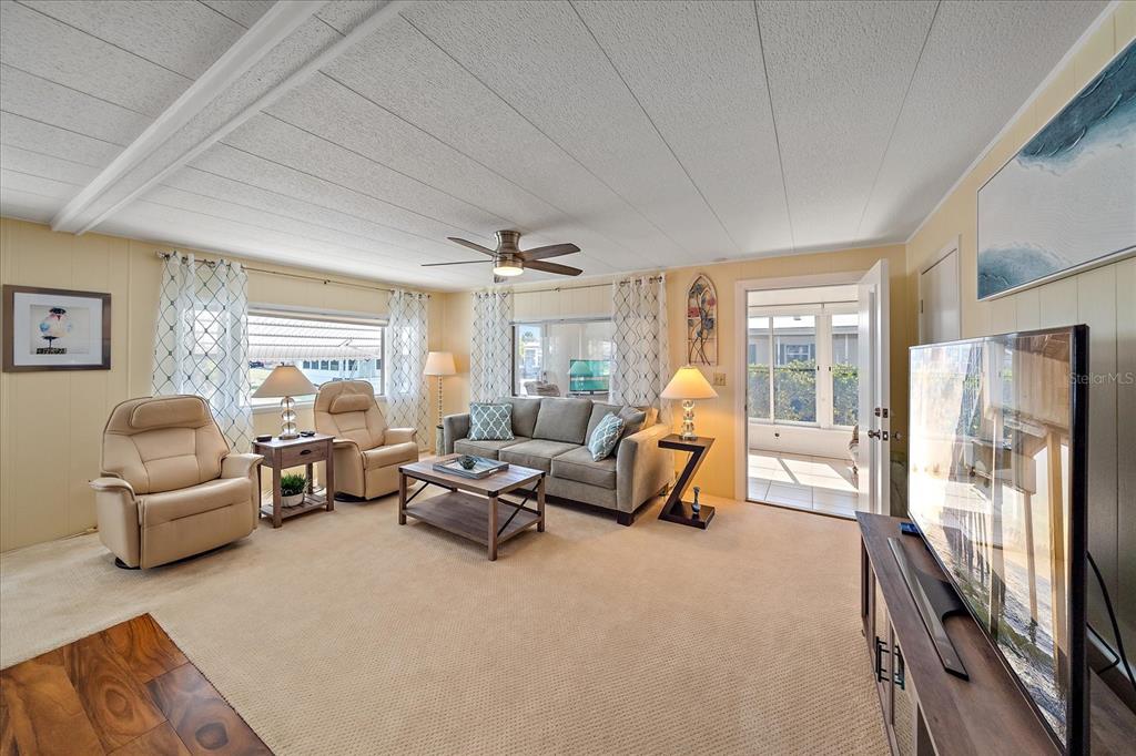 521 Roma Road Venice, FL 34285 - Photo 6 of 57 a living room with furniture and a flat screen tv