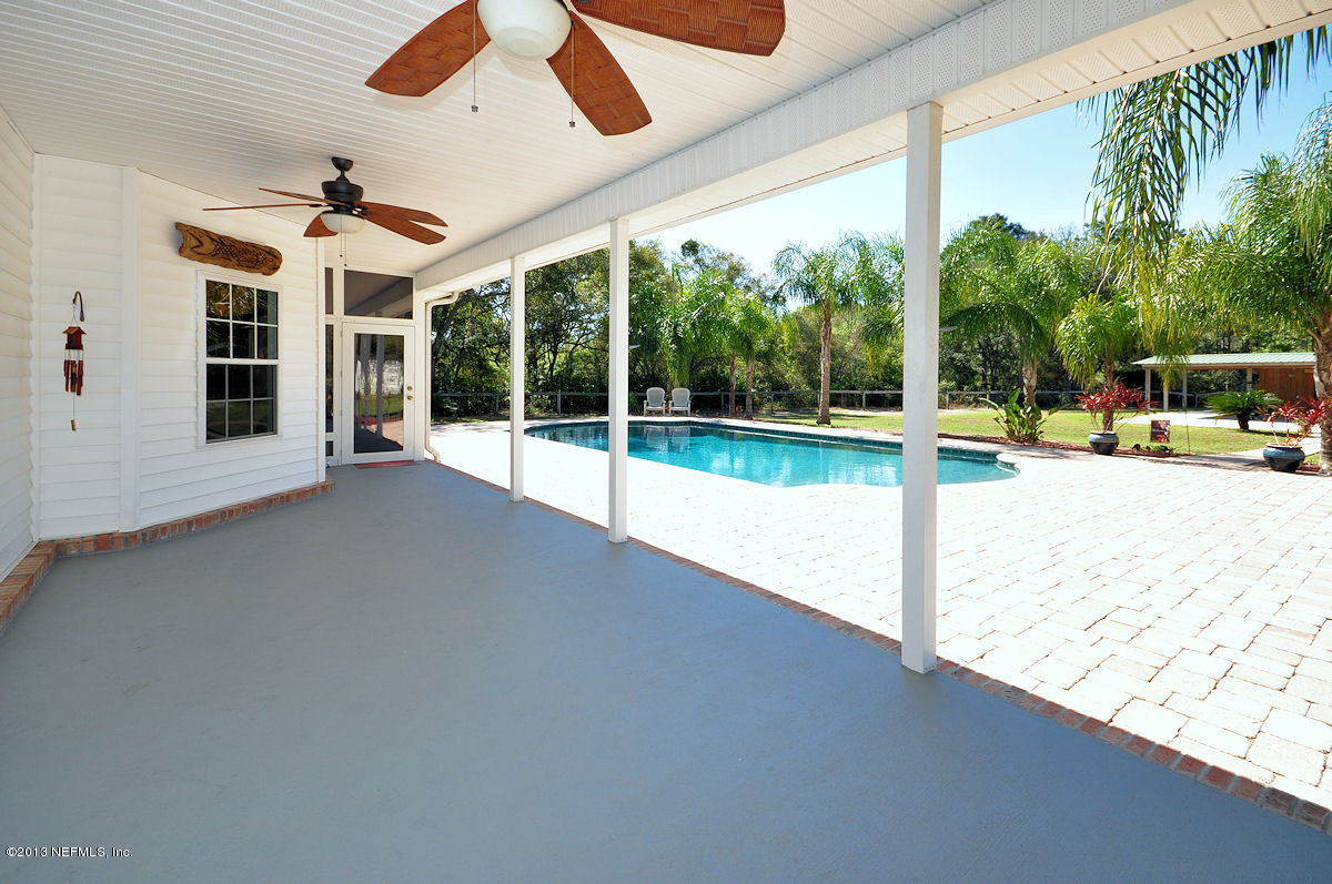 16024 Shellcracker Road Jacksonville, FL 32226 - Photo 13 of 26 a view of a garden with porch and furniture