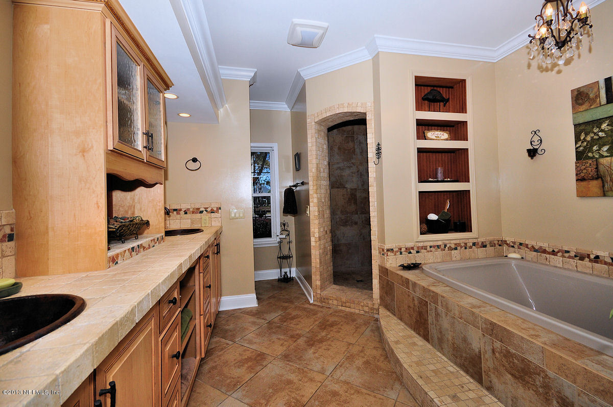 16024 Shellcracker Road Jacksonville, FL 32226 - Photo 15 of 26 a kitchen with a refrigerator and a sink