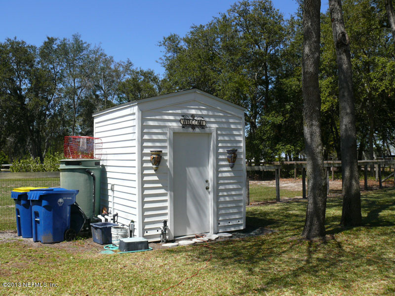 16024 Shellcracker Road Jacksonville, FL 32226 - Photo 25 of 26 a view of a house with backyard and tree