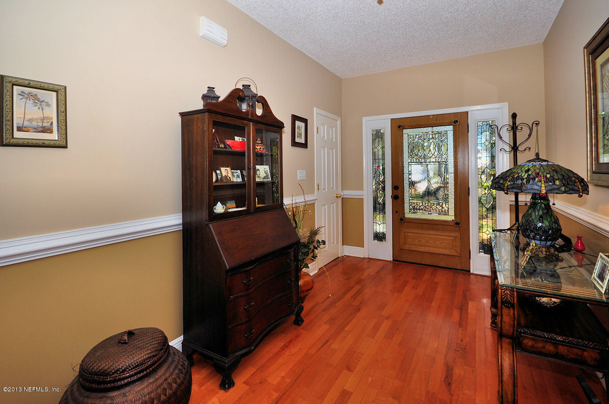 16024 Shellcracker Road Jacksonville, FL 32226 - Photo 4 of 26 a living room with hard wood floors and a window