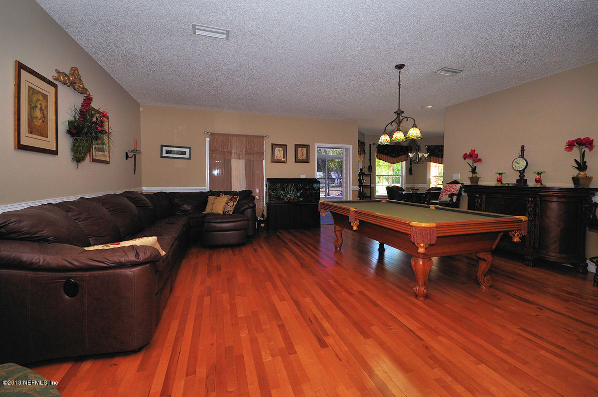 16024 Shellcracker Road Jacksonville, FL 32226 - Photo 5 of 26 a living room with furniture and a wooden floor