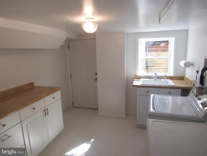 4448 Reservoir Road Northwest Washington, DC 20007 - Photo 14 of 16 Practicall Area with sink & cabinets