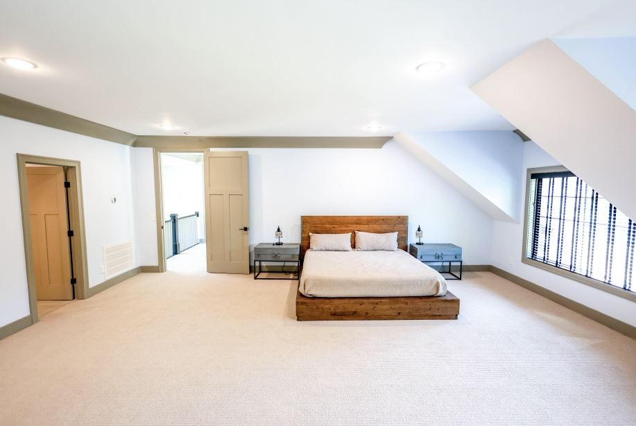 2025 Nelson Lane Murfreesboro, TN 37129 - Photo 24 of 35 a spacious bedroom with a bed and lamp