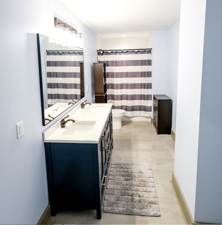 2025 Nelson Lane Murfreesboro, TN 37129 - Photo 25 of 35 a bathroom with a sink and a mirror