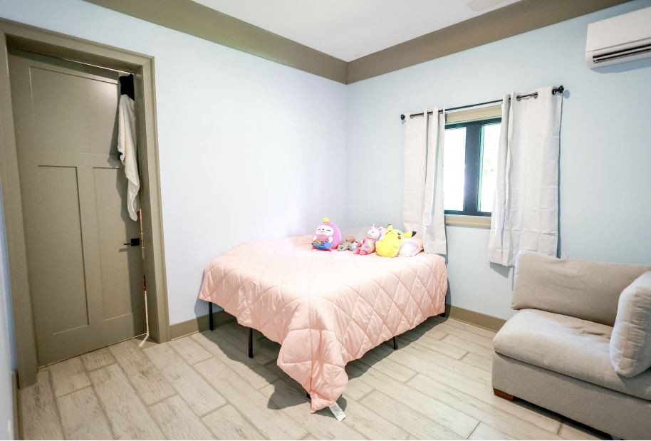 2025 Nelson Lane Murfreesboro, TN 37129 - Photo 26 of 35 a bedroom with a bed couch and a window