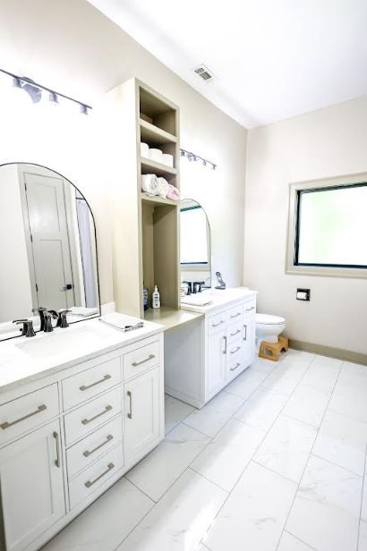 2025 Nelson Lane Murfreesboro, TN 37129 - Photo 28 of 35 a spacious bathroom with a double vanity sink mirror and