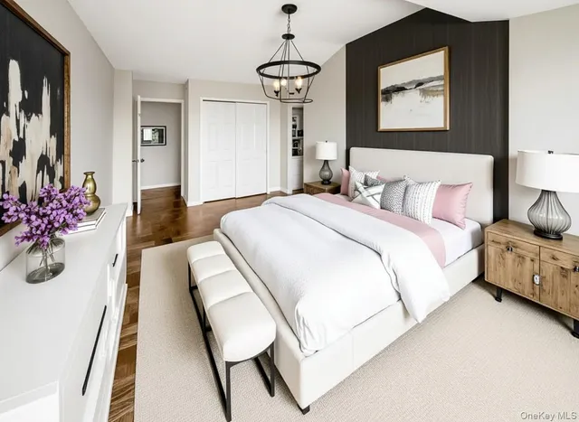 a bedroom with a bed and dresser