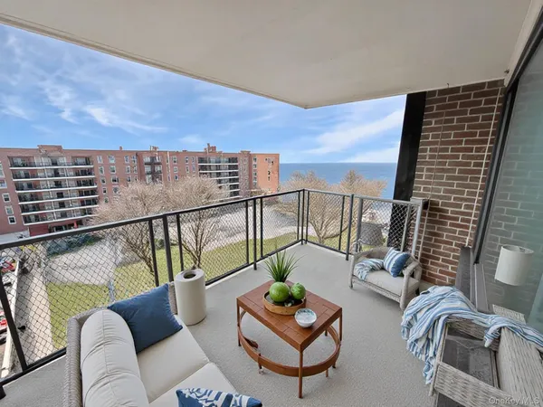 a view of a roof deck with seating space