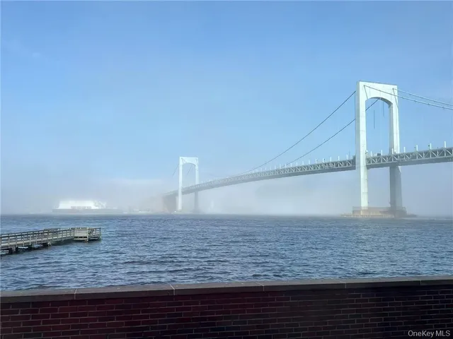 a bedroom with bed and window