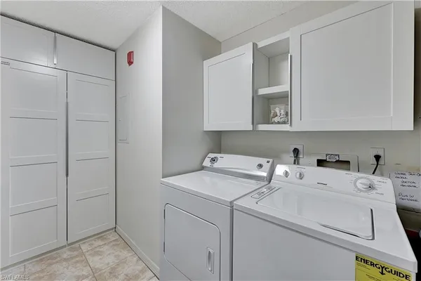 a balcony with furniture and a large window