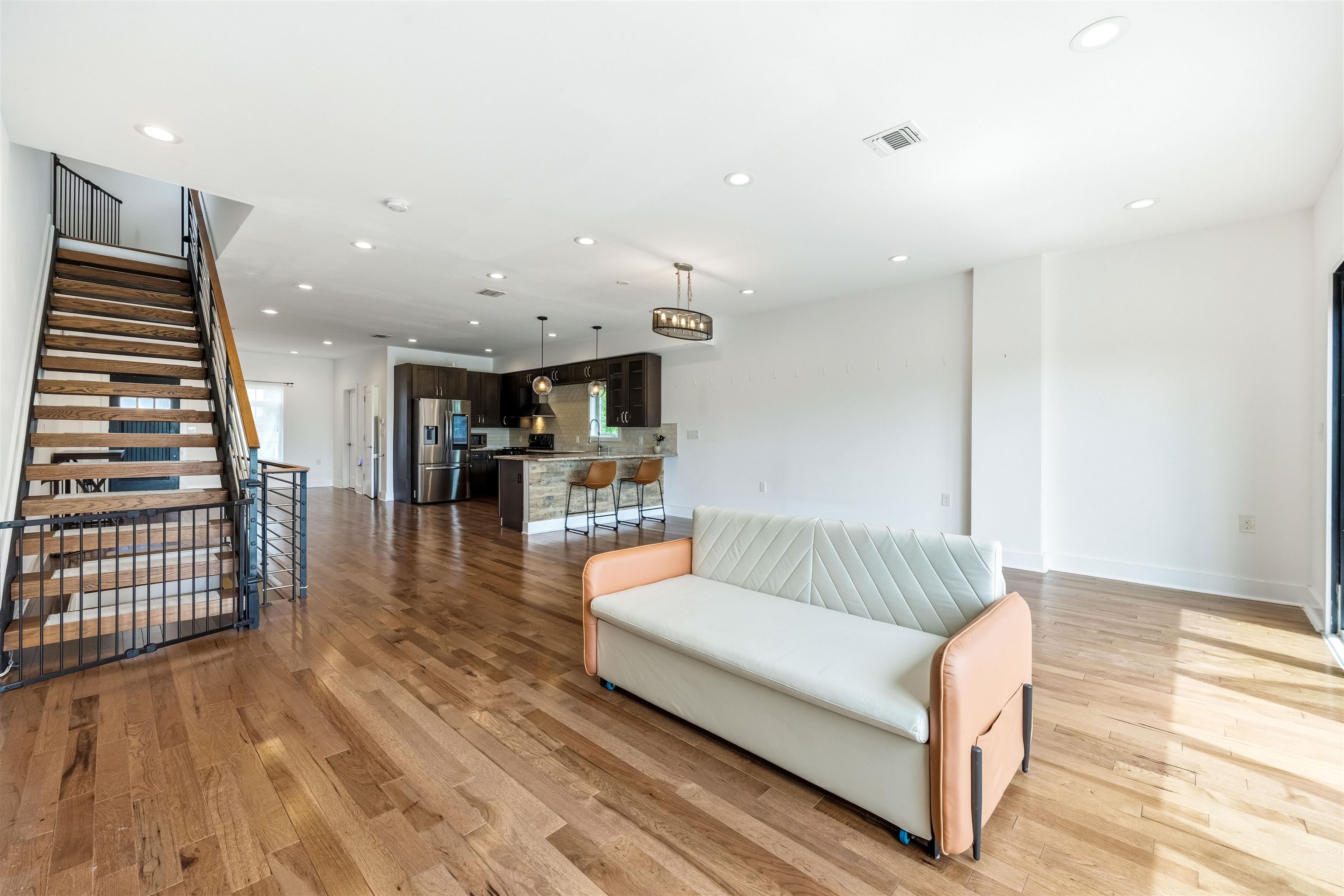 107 Mountain Road Jersey City, NJ 07307 - Photo 7 of 41 a living room with furniture and wooden floor