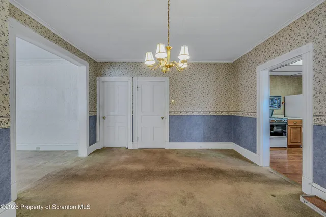 a kitchen with stainless steel appliances granite countertop a refrigerator and a stove